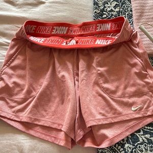Nike peach pink color shorts. T-shirt material. Comfy. Dri-fit. Size medium.